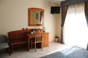 TV a/nebo společenská místnost v ubytování Hotel Barbieri