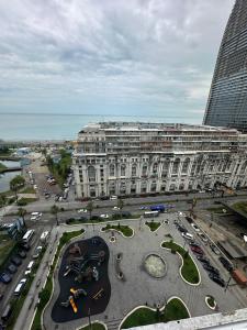 a large building with a parking lot in front of it at McDonald's in Itʼkhvisi
