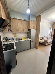 a kitchen with a sink and a refrigerator at McDonald's in Itʼkhvisi +5 photos