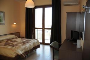 Postel nebo postele na pokoji v ubytování Hotel Barbieri