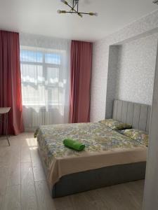 Postel nebo postele na pokoji v ubytování Квартира