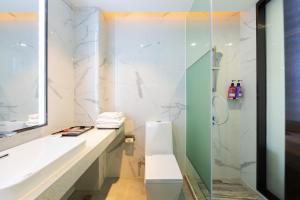 Kopalnica v nastanitvi Warm Yes Business Hotel -Free shuttle bus during the Canton Fair