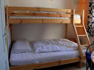 a bunk bed with a ladder on top of it at Mas de Perimont 28 in Fleury