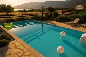 a swimming pool with a view of a mountain at Seaside Aqua Bliss & Serenity with Private Pool in Koilás