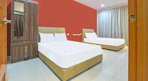 Postel nebo postele na pokoji v ubytování OYO 90522 Alma Sweet Home