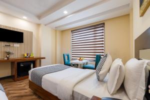 Postel nebo postele na pokoji v ubytování HOTEL NEU VILLA - New Delhi City Center