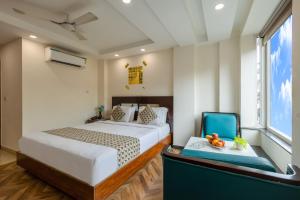 Postel nebo postele na pokoji v ubytování HOTEL NEU VILLA - New Delhi City Center