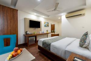 Postel nebo postele na pokoji v ubytování HOTEL NEU VILLA - New Delhi City Center