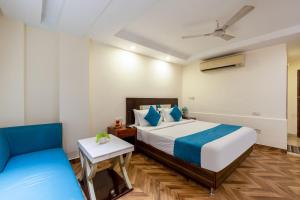Postel nebo postele na pokoji v ubytování HOTEL NEU VILLA - New Delhi City Center