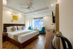Postel nebo postele na pokoji v ubytování HOTEL NEU VILLA - New Delhi City Center