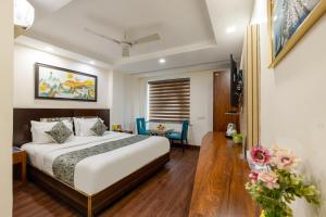 Postel nebo postele na pokoji v ubytování HOTEL NEU VILLA - New Delhi City Center