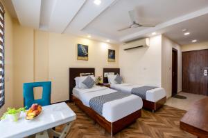 Postel nebo postele na pokoji v ubytování HOTEL NEU VILLA - New Delhi City Center