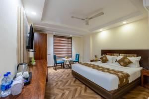 Postel nebo postele na pokoji v ubytování HOTEL NEU VILLA - New Delhi City Center