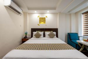 Postel nebo postele na pokoji v ubytování HOTEL NEU VILLA - New Delhi City Center