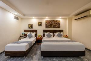 Postel nebo postele na pokoji v ubytování HOTEL NEU VILLA - New Delhi City Center