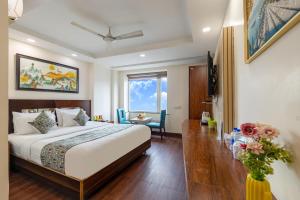 Postel nebo postele na pokoji v ubytování HOTEL NEU VILLA - New Delhi City Center