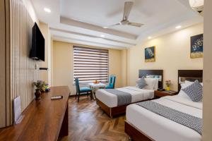 Postel nebo postele na pokoji v ubytování HOTEL NEU VILLA - New Delhi City Center