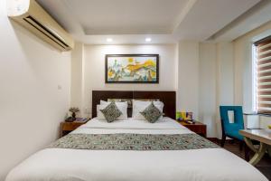 Postel nebo postele na pokoji v ubytování HOTEL NEU VILLA - New Delhi City Center
