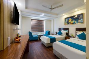 Postel nebo postele na pokoji v ubytování HOTEL NEU VILLA - New Delhi City Center