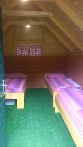 a room with two bunk beds in a attic at Camping Drina in Foča