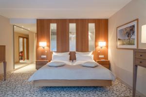 Postel nebo postele na pokoji v ubytování Hotel Deimann