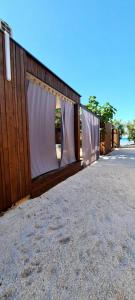 a building with curtains on the side of it at Stylish beach house in Privlaka in Privlaka