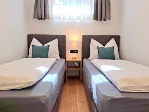 Posteľ alebo postele v izbe v ubytovaní Apt Julia - Haus Ivo