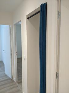 a closet with a sliding door in a room at Appartement Ortesene in Hasparren
