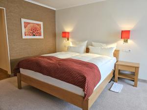 Postel nebo postele na pokoji v ubytování Hotel Deimann