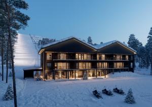 ein Haus im Schnee mit Skiern im Schnee in der Unterkunft Crest Chalet Ski-in Ski-out by Aavalevi in Levi + 4 Fotos