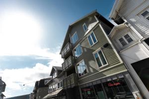 a tall building on a city street at Bris Apartments in Haugesund