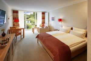 Postel nebo postele na pokoji v ubytování Hotel Deimann