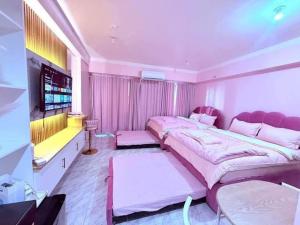 Ένα ή περισσότερα κρεβάτια σε δωμάτιο στο SMDC Style Residences Iloilo City +23 φωτογραφίες