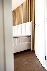 a bedroom with a bed with white pillows at Prázdninový dům Mikulov in Mikulov