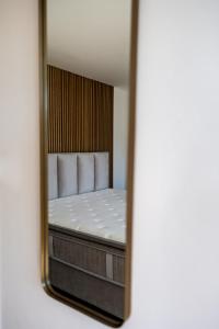 a reflection of a bed in a mirror at Prázdninový dům Mikulov in Mikulov