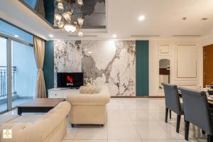 a living room with a couch and a table at The Regal Residence at Vinhomes in Ho Chi Minh City +238 photos