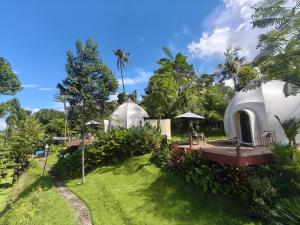 a view of two domes in a garden at The Dome Ukiran Hills in Manggis