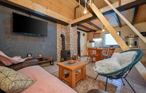a living room with a couch and a tv at Gorgeous Home In Bjelovar 