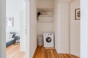 a washer and dryer in a living room at Cozy 1BR - Family Retreat in Potsdam! in Potsdam