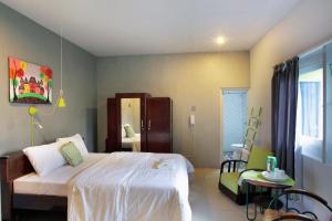 Ένα ή περισσότερα κρεβάτια σε δωμάτιο στο Jeng Tini Guest House