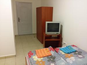 A television and/or entertainment centre at M+D Hotel