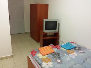 A television and/or entertainment centre at M+D Hotel