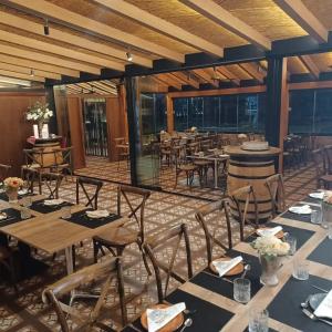 a dining room with tables and chairs in a room at Hostal Casa Pancho in Sangonera La Seca