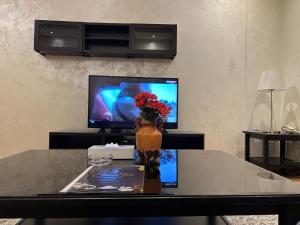 Telewizja i/lub zestaw kina domowego w obiekcie Le Park Hotel