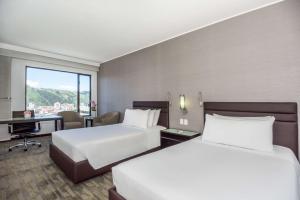 Letto o letti in una camera di NH Collection Quito Royal