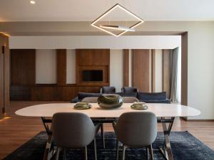 a dining room with a table and chairs at Swissôtel Resort Bodrum Beach in Turgutreis