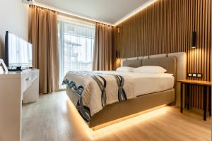 Postel nebo postele na pokoji v ubytování Galeon Residence & SPA