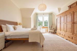 Ένα ή περισσότερα κρεβάτια σε δωμάτιο στο Hazelton Townhouse - Crail
