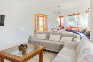 a living room with a couch and a table at Casa Sol, Rodalquilar in Rodalquilar