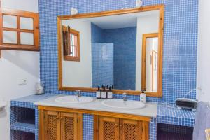 a bathroom with a sink and a mirror at Casa Sol, Rodalquilar in Rodalquilar +37 photos
